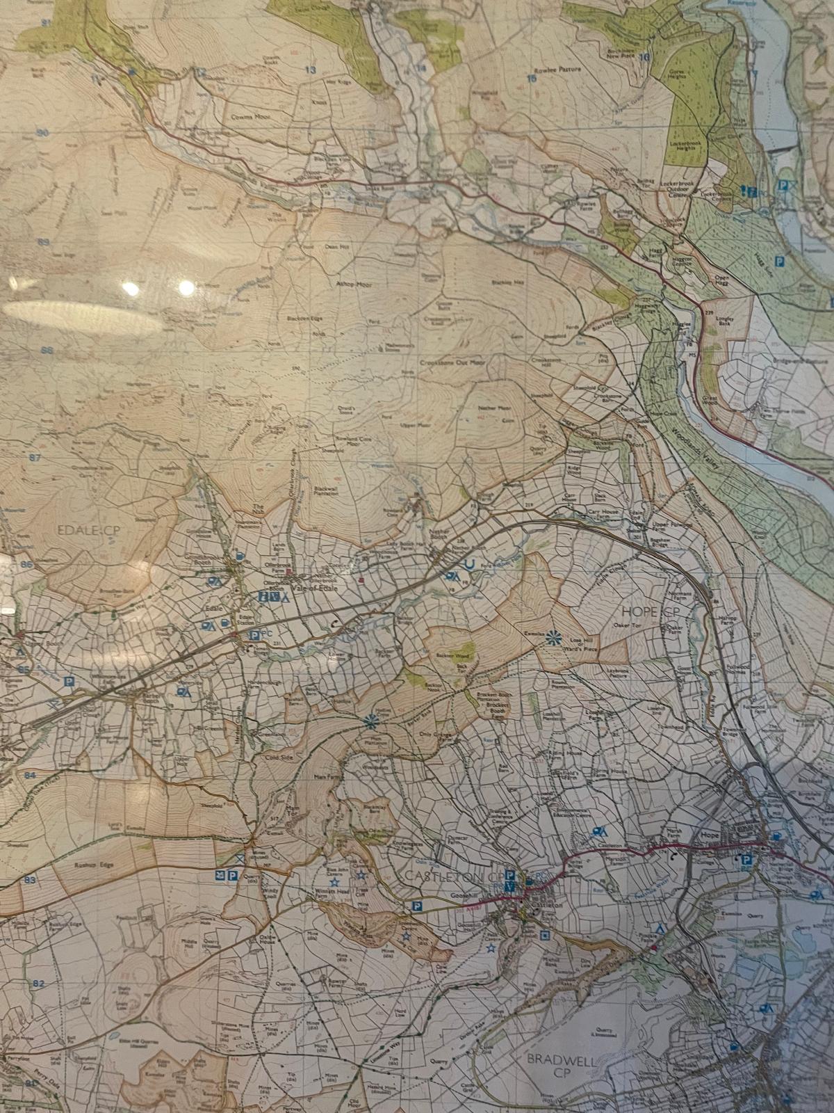 Map of the Peak District highlighting trails and landmarks for outdoor exploration and adventure